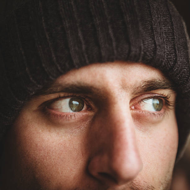 istock caucasian pensive man with knit hat portrait 466414391