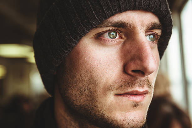 istock caucasian pensive man with knit hat portrait 466414397
