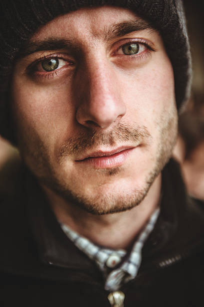 istock caucasian pensive man with knit hat portrait 466414415
