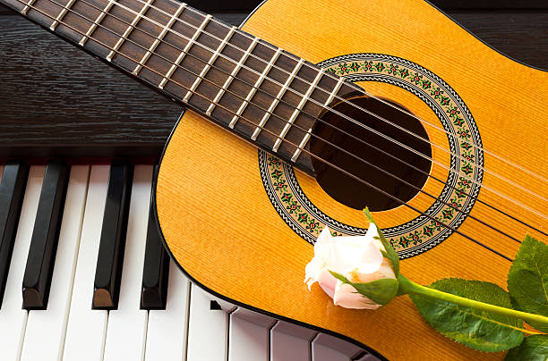 istock Rose on guitar with piano key. 466414734