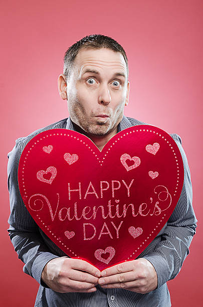 istock Man with Valentine's Day heart 466415251