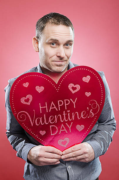 istock Man with Valentine's Day heart 466415253