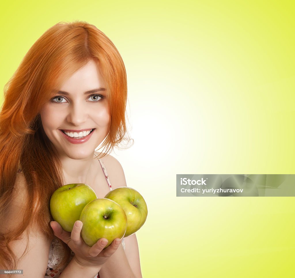 young beauty woman with apple on green background 2015 Stock Photo