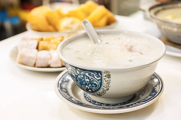 Classic Hong Kong congee served in local cafe Congee is a classic Asian food. It is a type of rice porridge, seen here in a local Hong Kong cafe. cantonese cuisine stock pictures, royalty-free photos & images