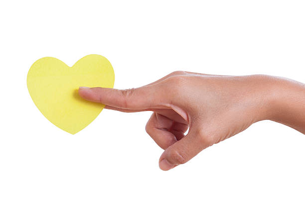 istock hand holding paper heart, 466418811