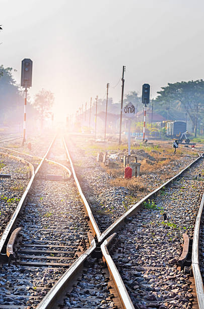 binari in una scena rurale - railroad track train journey rural scene foto e immagini stock