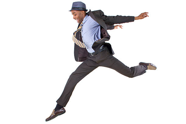 istock Man leaping in business clothes on white background 466421711