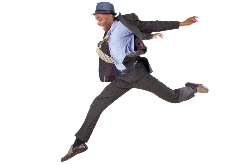 young black businessman leaping / jumping high
