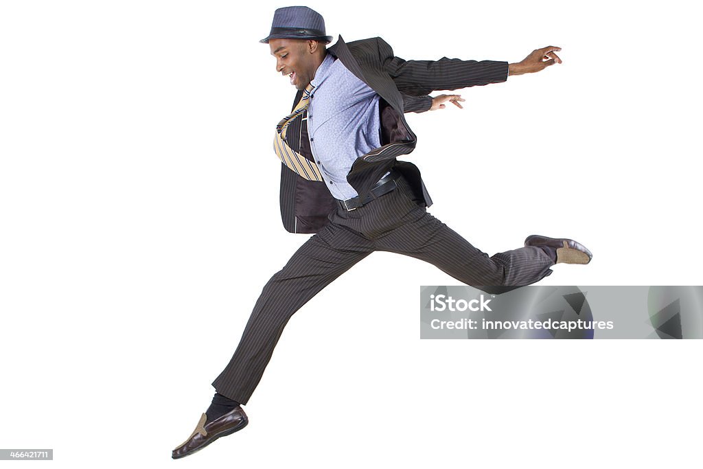 Man leaping in business clothes on white background young black businessman leaping / jumping high Jumping Stock Photo