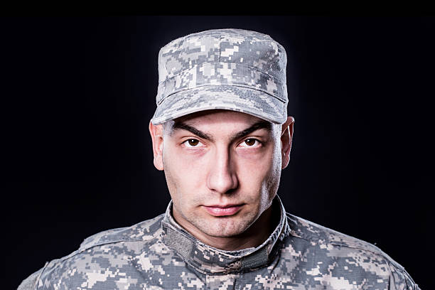 istock Proud male army soldier on black background 466422082