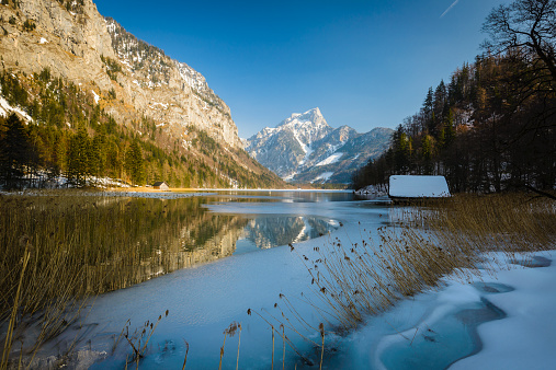 Landscape with forest lake in winter. Leopoldsteinersee,Styria,Austria.