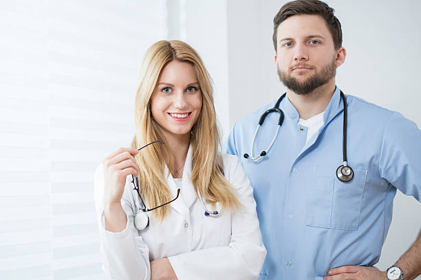 istock Portrait of young smiling physicians 466422766
