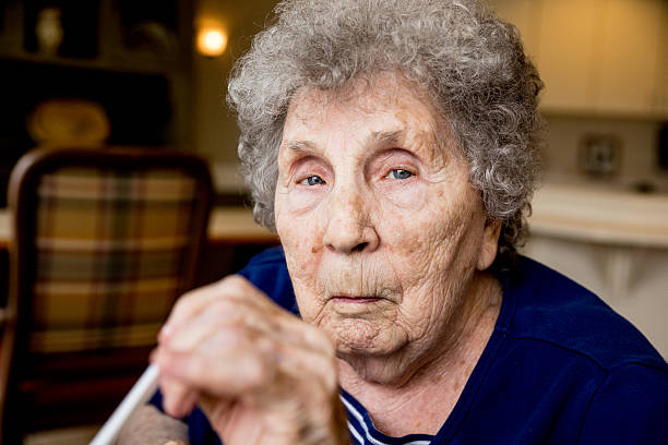 istock Elderly Woman with Grey Hair Looking At Camera 466423700