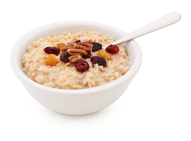 oatmeal schale mit getrockneten früchten und nüssen (with path) - oatmeal porridge oat raisin stock-fotos und bilder