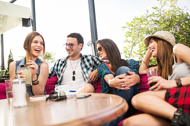 istock Cheerful friends talking to each other in a cafe. 466425118