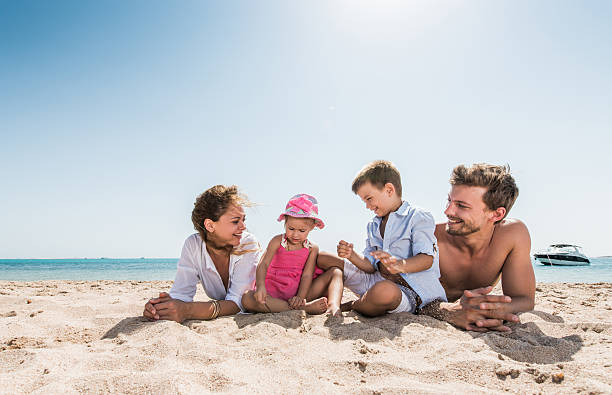 istock Young family enjoying a day on the beach. 466425464