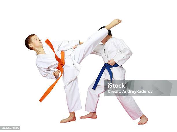 Athletes Karate Are Training Paired Exercises On A White Background Stock Photo - Download Image Now