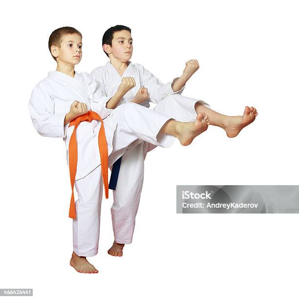 On A White Background Boys Athletes Train Beat Kicks Stock Photo - Download Image Now