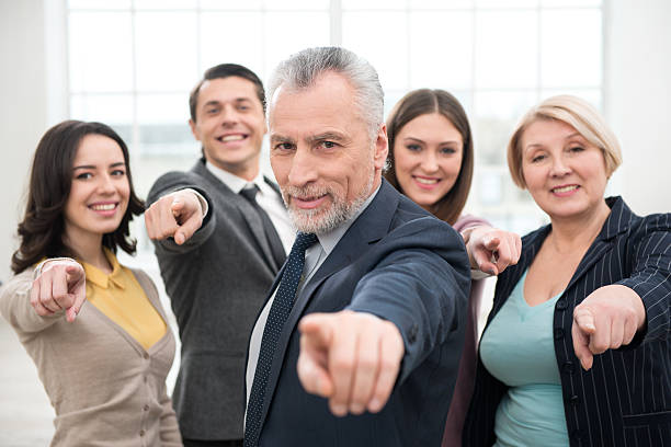 istock Business team looking and pointing at camera 466428010