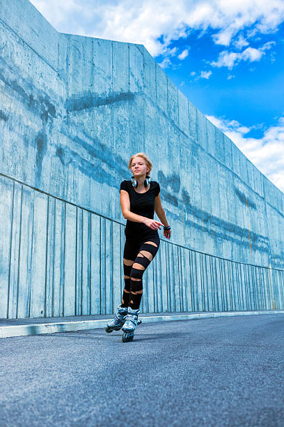 istock Young adult roller skating on the streets 466429629