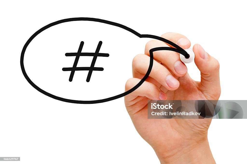 Hashtag speech bubble concepts Hand sketching Hashtag Speech Bubble Concept with black marker on transparent wipe board. Announcement Message Stock Photo