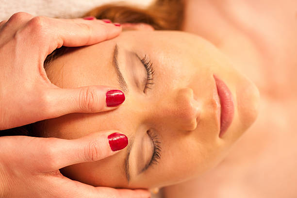 istock Woman having face massage treatment in wellness 466430424