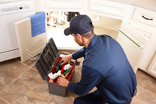 istock Plumber working under sink in home kitchen. Repairman. Repairing, installing. 466431175
