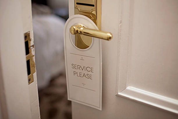 istock Tag hung on a hotel room door handle requesting for service 466433338