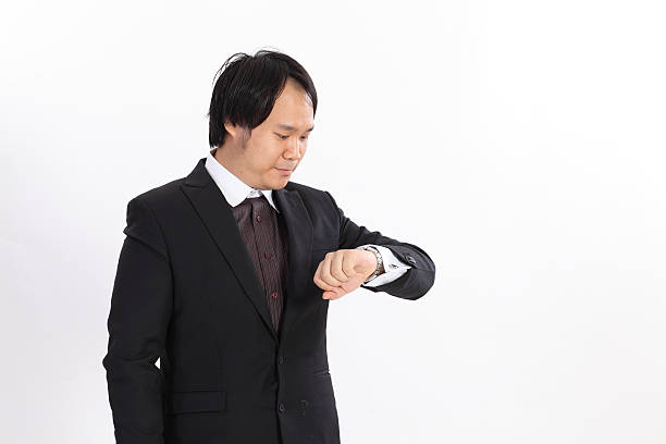 istock Isolated Businessman looking at his watch 466434623