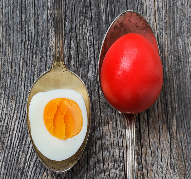 istock Easter eggs in old silver spoon on old wooden background 466437714