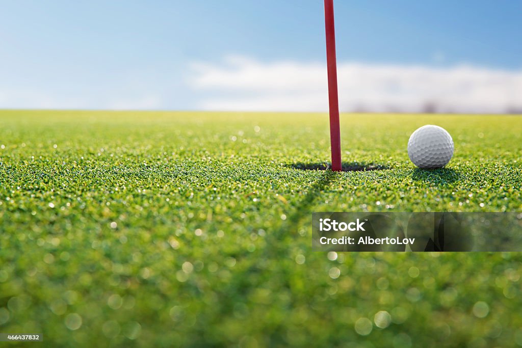 golf red hole Golf ball near the red hole Golf Stock Photo