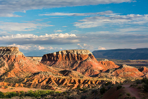 Looking at the red rocks at Ghost Ranch Late afternoon in the Red Rocks area of Northern New Mexico featuring amazing colors and rock formations new mexico stock pictures, royalty-free photos & images