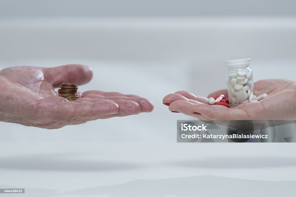 Money for medicines Close-up of poor couple without money for medicines Capsule - Medicine Stock Photo