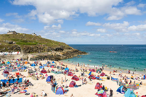 St Ives, England - August 29, 2011: Beach goers enjoying the late summer at Porthgwidden beach. 