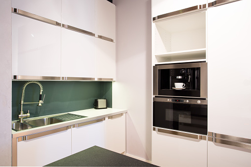 Horizontal view of bright white kitchen interior