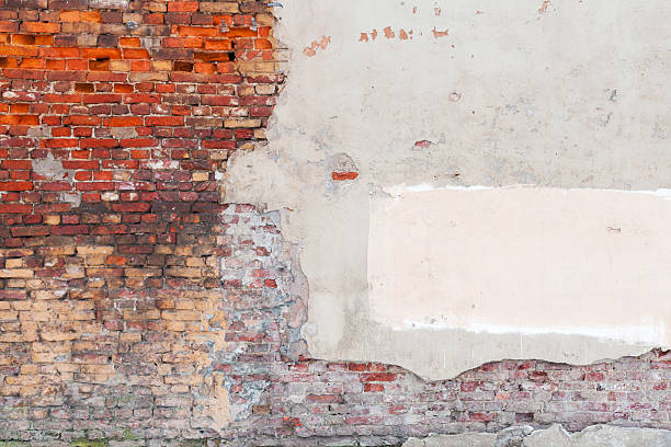 istock Old grunge wall background texture with bricks and stucco 466439275