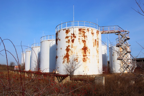 A photo of abandoned oil storage tanks park with stairs