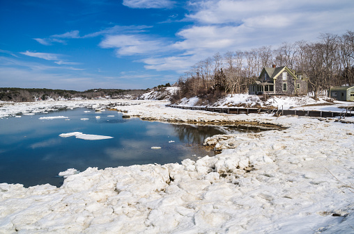 Floes of ice clog the shoreline  and waterways of Pamet Harbor in Truro, Massachusetts after a severe Winter.