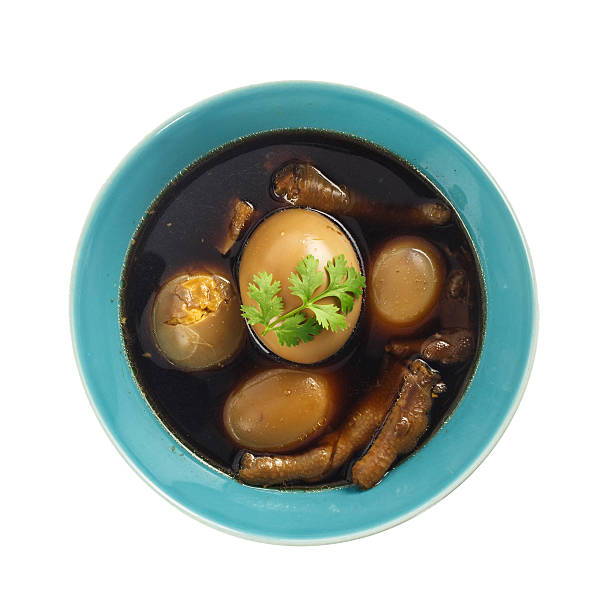 istock Thai cuisine - Eggs and chicken in brown sauce 466442408