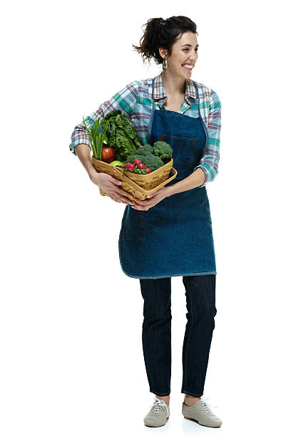 istock Cheerful female farmer holding vegetable basket 466442758