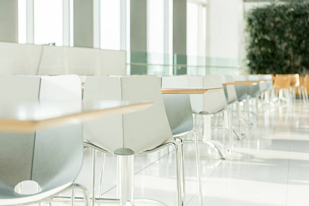 istock Tables and chairs in modern building interior 466445198