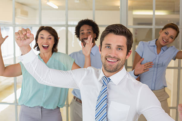 istock Cheerful young business colleagues cheering 466445416