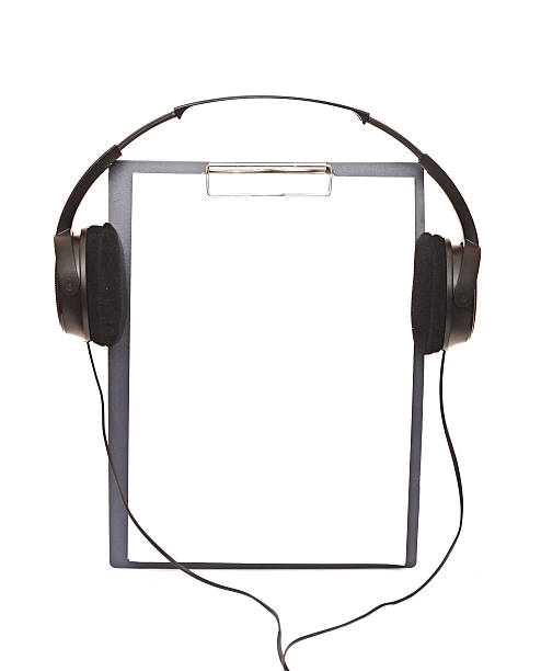 istock black headphone and blank clipboard close up 466446807