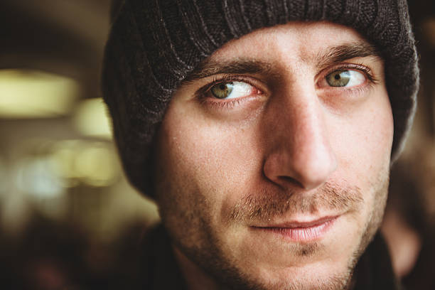 istock caucasian pensive man with knit hat portrait 466452549