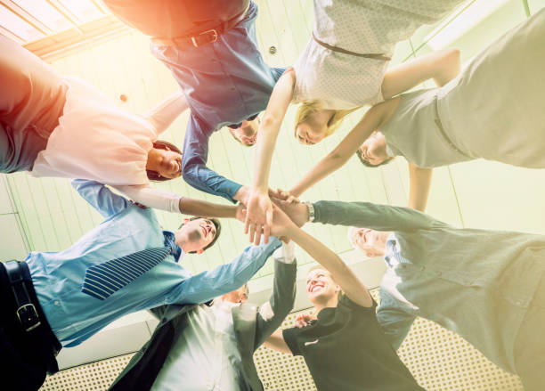 istock Unity of successful multi-ethnic business people holding hands 466452962