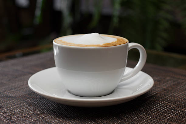 istock Cup of cappuccino over wooden table 466454532