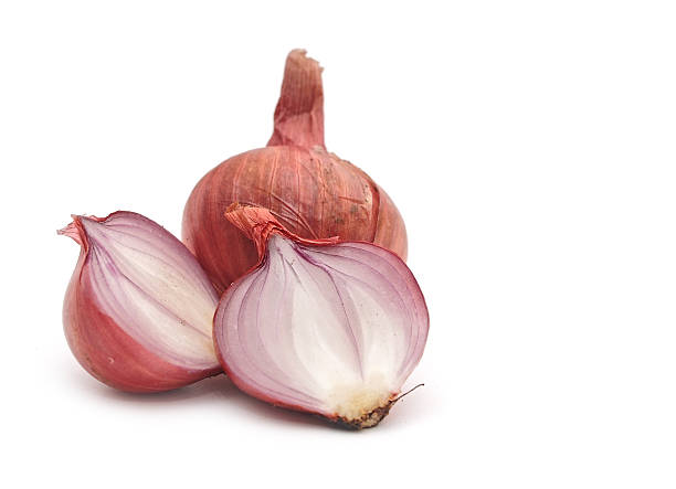 istock Red sliced onion isolated on white background 466456755