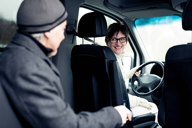 istock senior man sitting in paratransit van 466456841