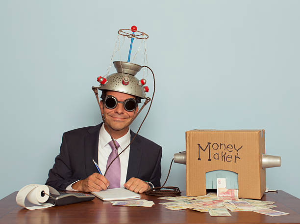 Businessman with Mind Reading Machine Makes Money A eccentric businessman feeds his money making machine with great ideas from his mind reading helmet and out comes lots of British Pounds Sterling. Quid. Retro styled. If making money was easy, it would be awesome. resourceful stock pictures, royalty-free photos & images