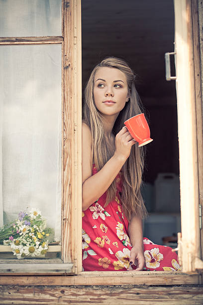 istock Young woman is drinking tea 466463163